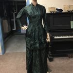 Dark green ladies bustle gown donated by Gloria Jackson